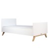 White wooden bed by Lynn Bopita